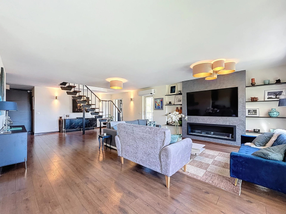 Interior of a renovated 195m2 duplex with spacious living room and staircase, Le Cannet.