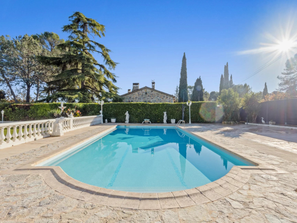 Swimming pool of a Provençal villa in Mougins with landscaped grounds and no overlooking neighbors.