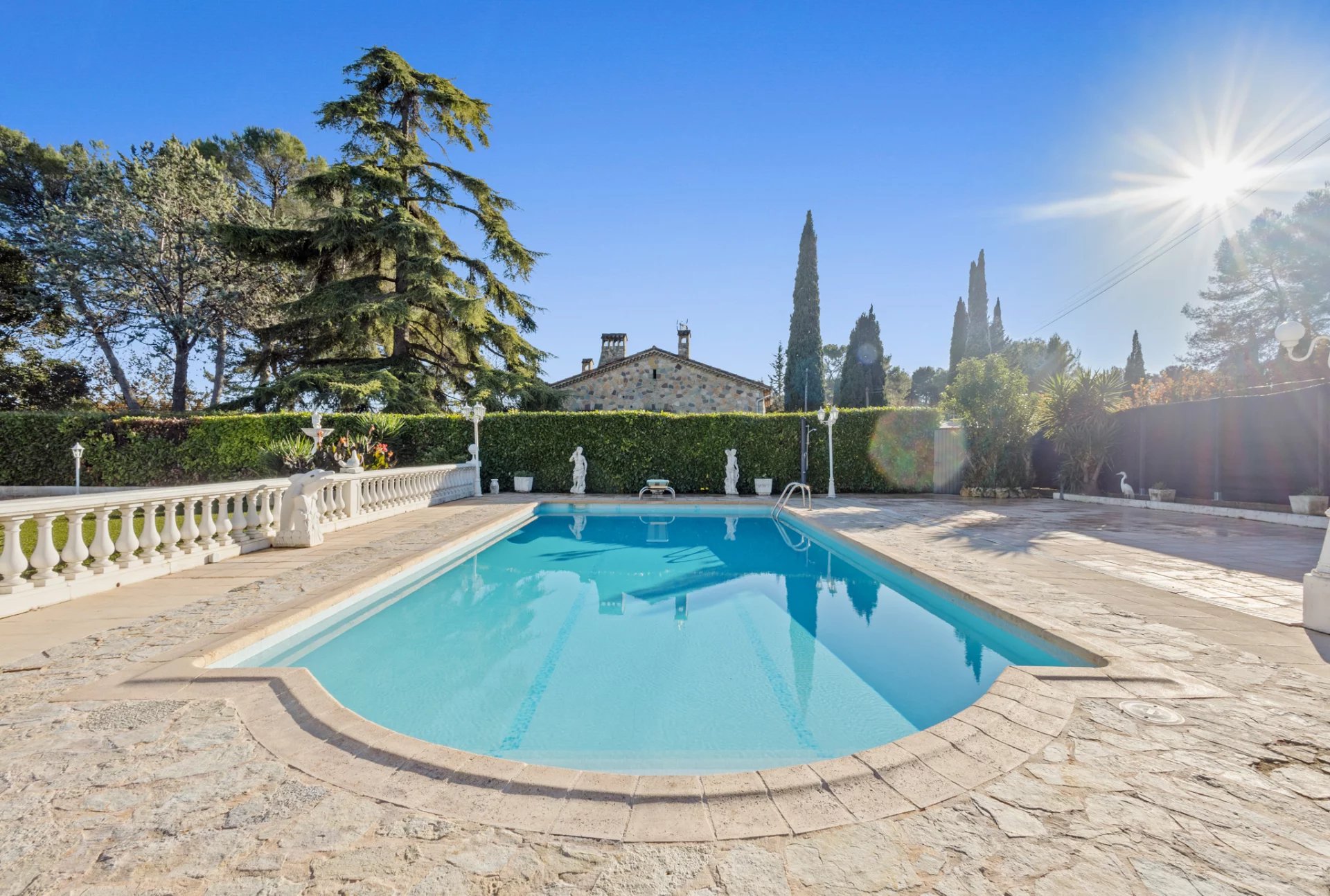 Swimming pool of a Provençal villa in Mougins with landscaped grounds and no overlooking neighbors.
