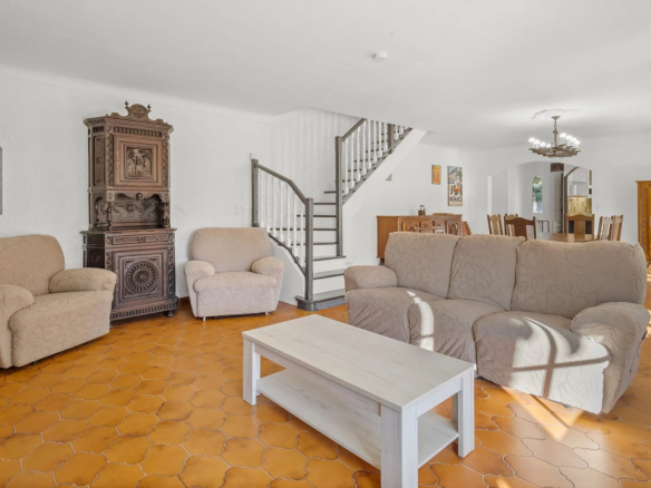 Interior of a Provençal villa in Mougins with living room, sofas and fireplace.