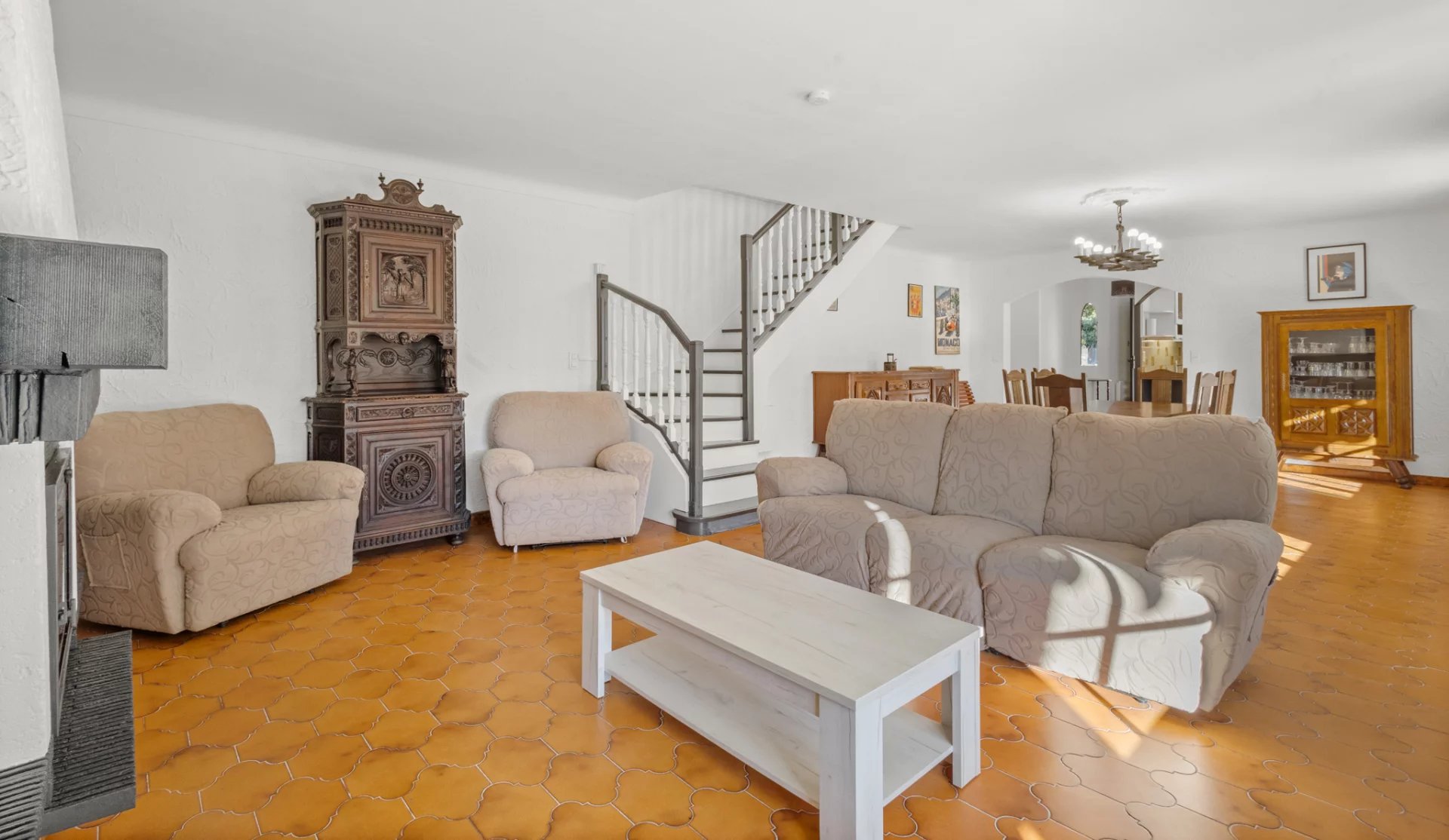 Interior of a Provençal villa in Mougins with living room, sofas and fireplace.