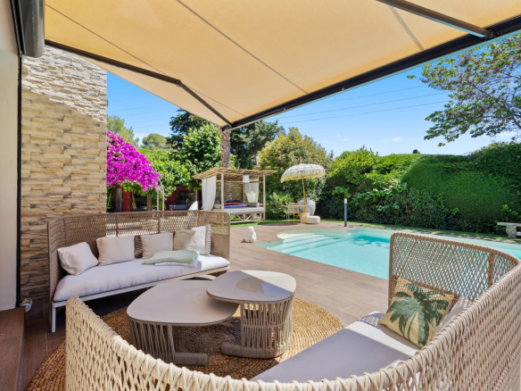 Terrace of a villa in Mougins with garden furniture and swimming pool