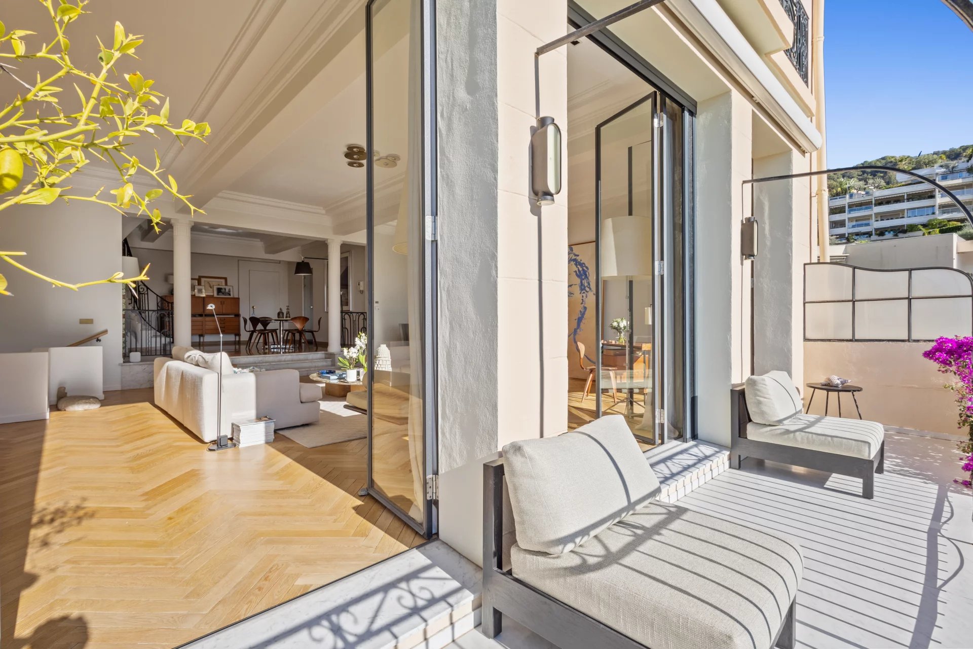 Terrace of a private mansion in Le Cannet with sea view, modern and bright furniture.