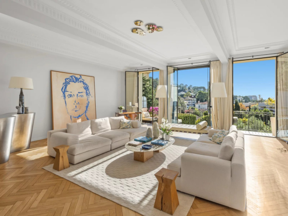 Interior of a renovated private mansion with a bright living room and sea view.