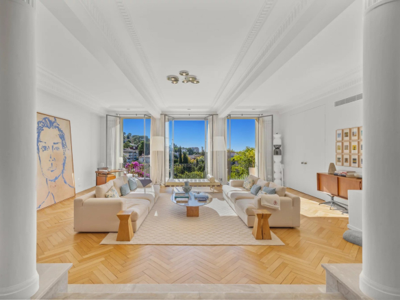 Interior of a bright private mansion with sea views, spacious living room and modern decor.