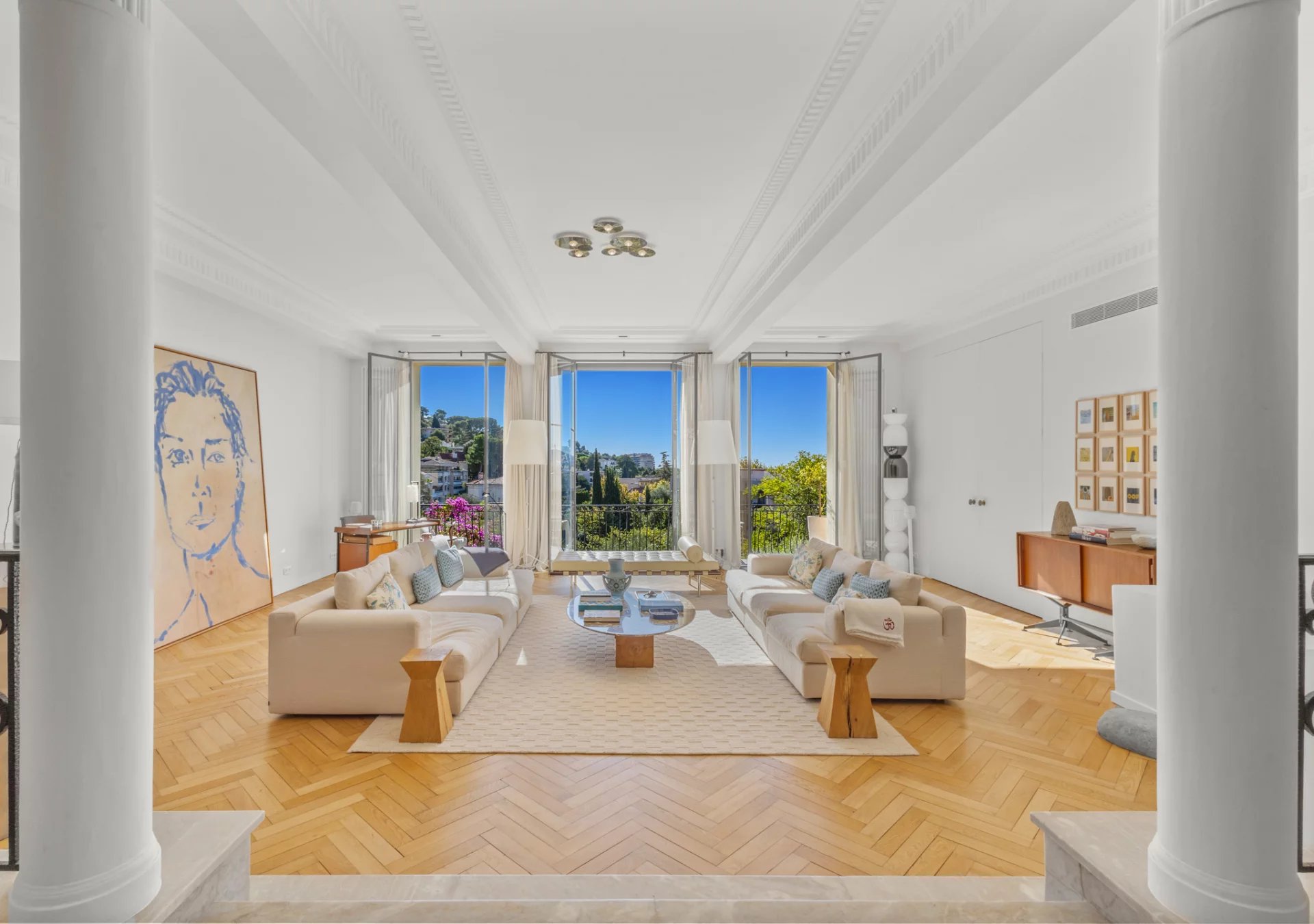 Interior of a bright private mansion with sea views, spacious living room and modern decor.