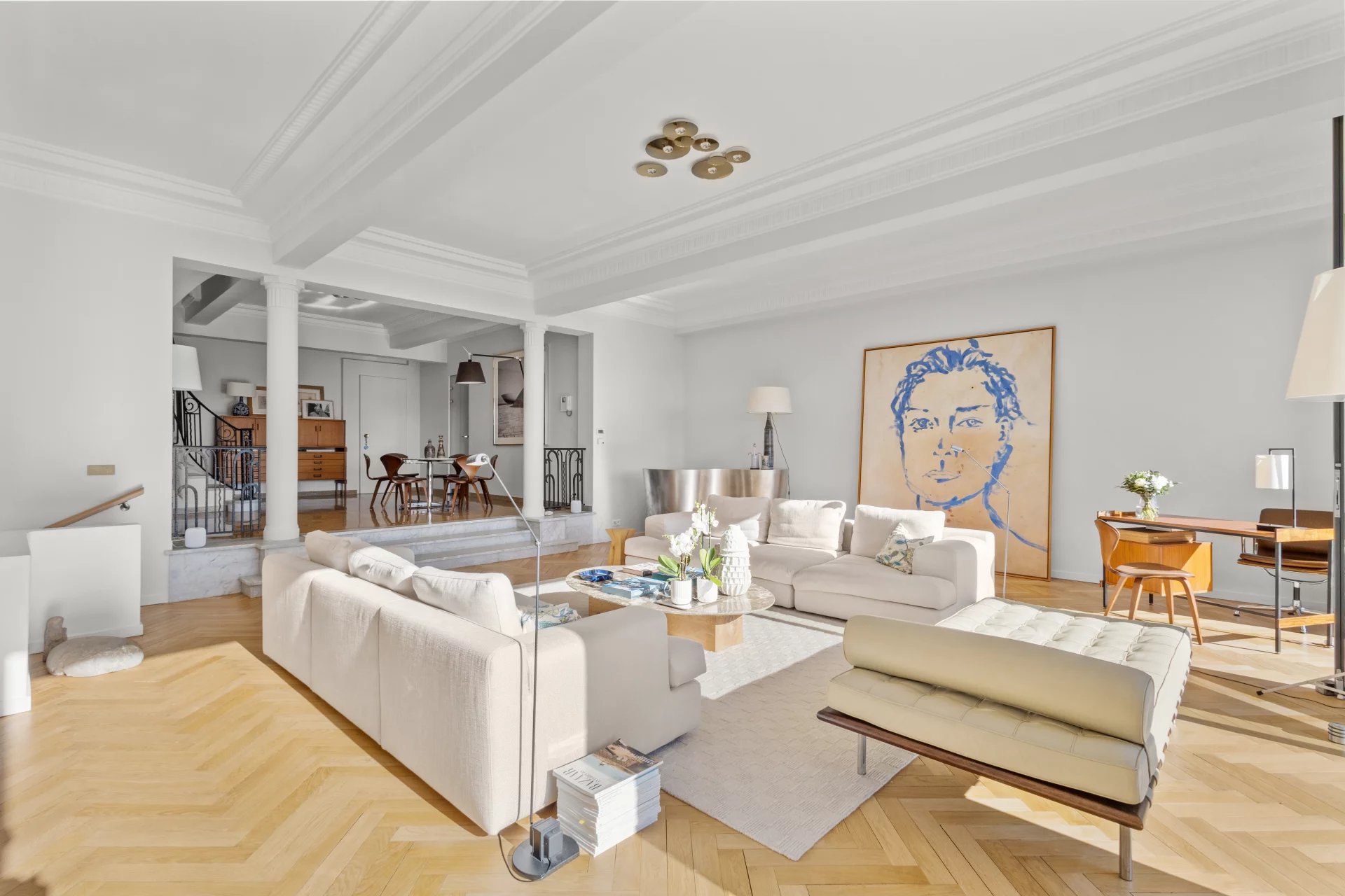 Interior of a renovated private mansion with a bright living room and modern decor.