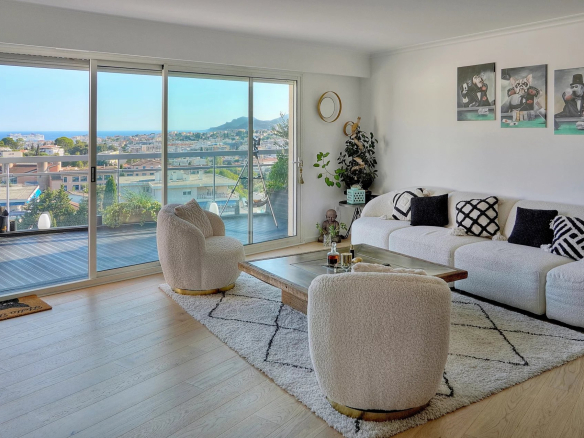 Bright living room with sea view, modern furniture and contemporary decor, Le Cannet.