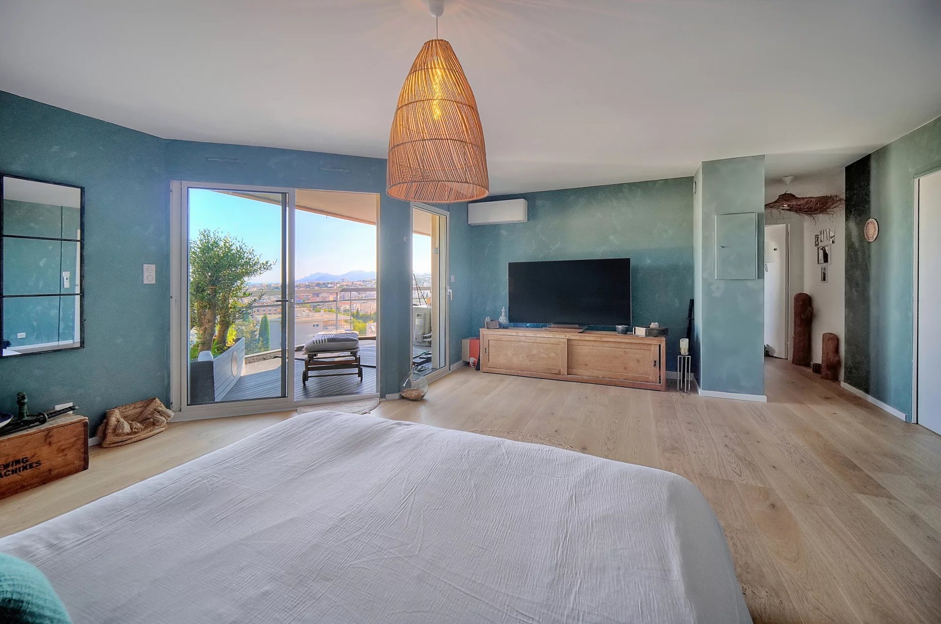 Interior of a top-floor apartment with sea views, modern and bright decor.