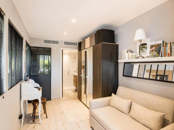 Interior of an elegant apartment with a sofa and tasteful decor in Cannes.