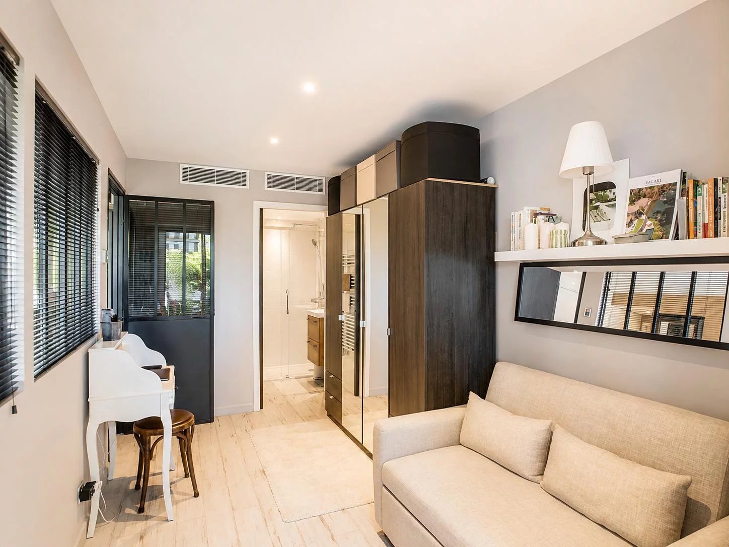 Interior of an elegant apartment with a sofa and tasteful decor in Cannes.