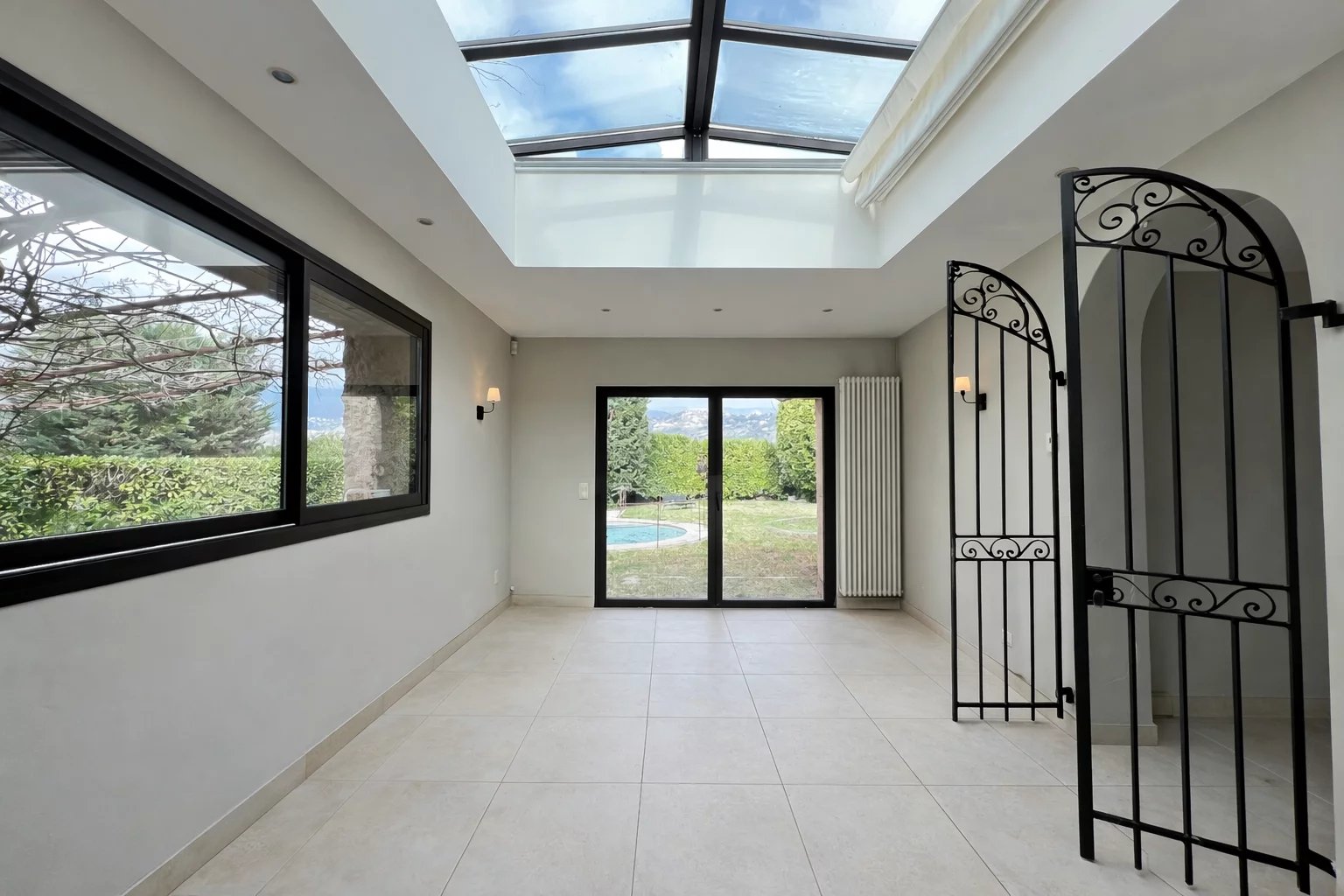 Interior of a villa in Opio Bright interior of a villa with access to a garden, wrought iron windows and door.
