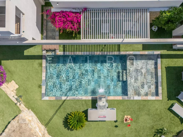 Aerial view of a contemporary villa with swimming pool and garden, La Ciotat.