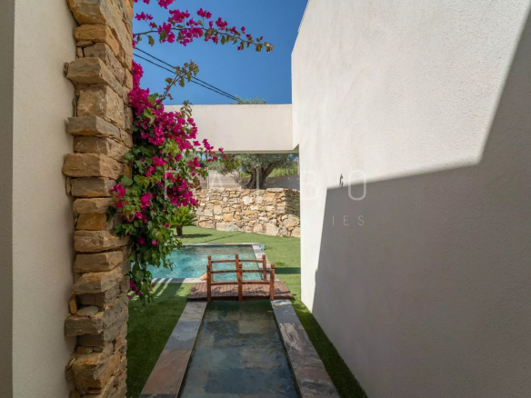 View of a garden with swimming pool and flowers, contemporary villa in La Ciotat.