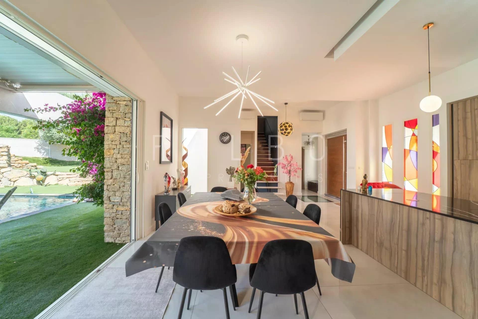 Interior of a contemporary villa with dining room and kitchen, La Ciotat