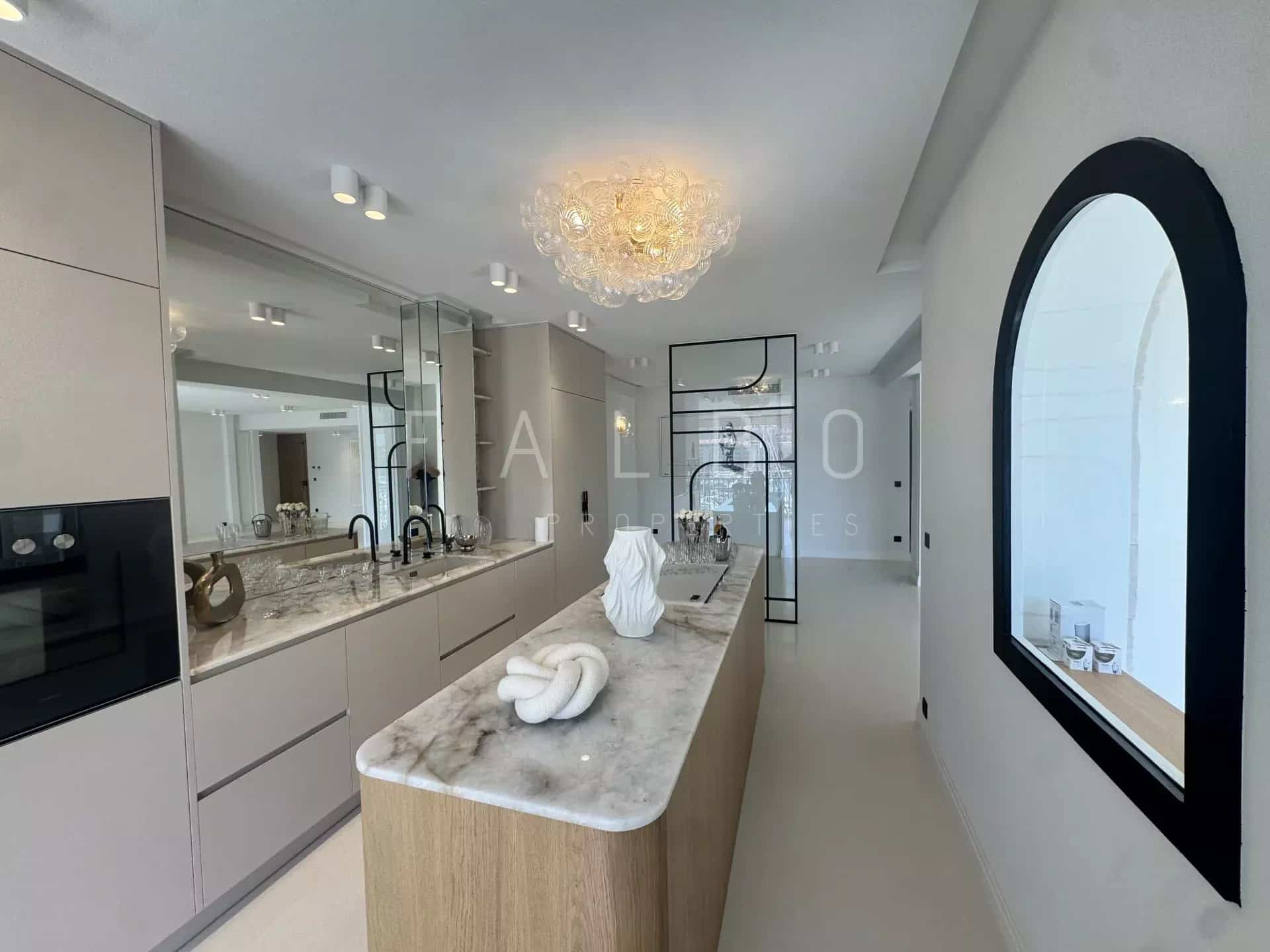 Modern and renovated kitchen with central island in an apartment in Marseille.