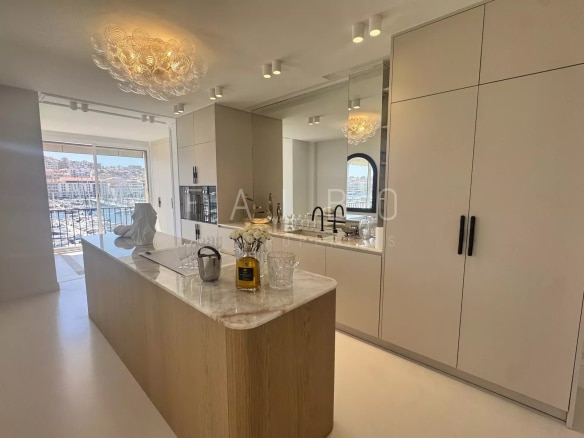 Modern and bright kitchen in a renovated apartment overlooking the Old Port in Marseille.