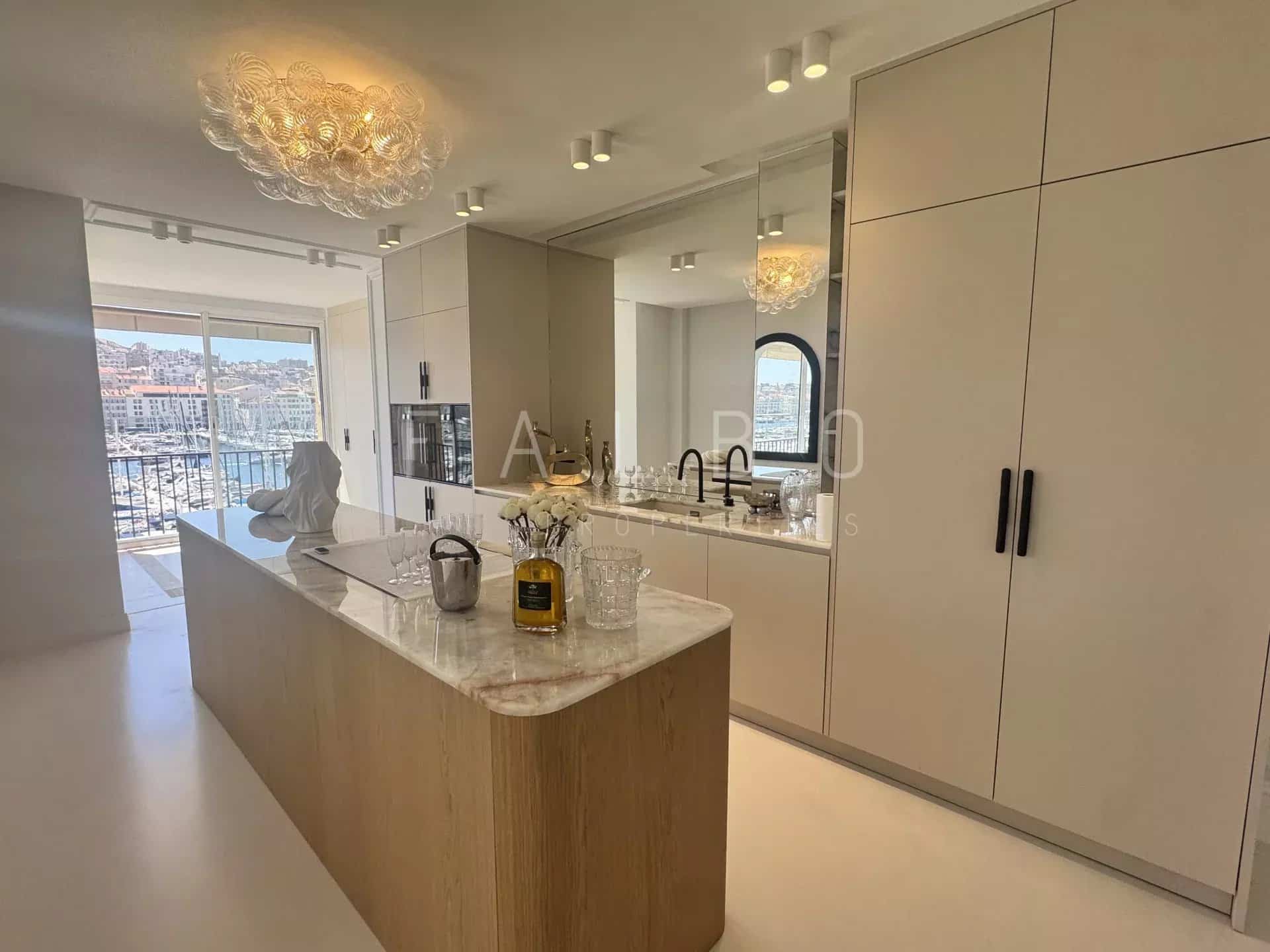 Modern and bright kitchen in a renovated apartment overlooking the Old Port in Marseille.