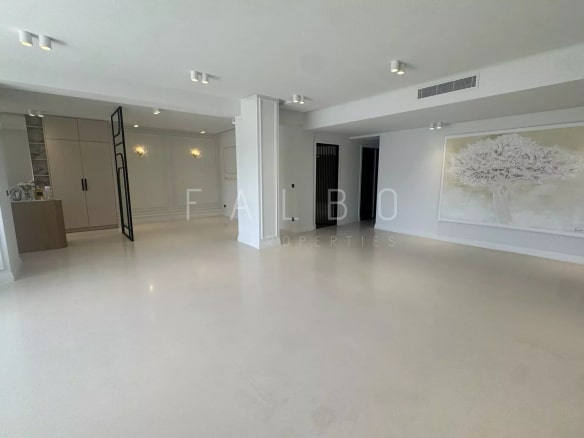 Interior of a renovated apartment with light flooring and modern walls in Marseille.