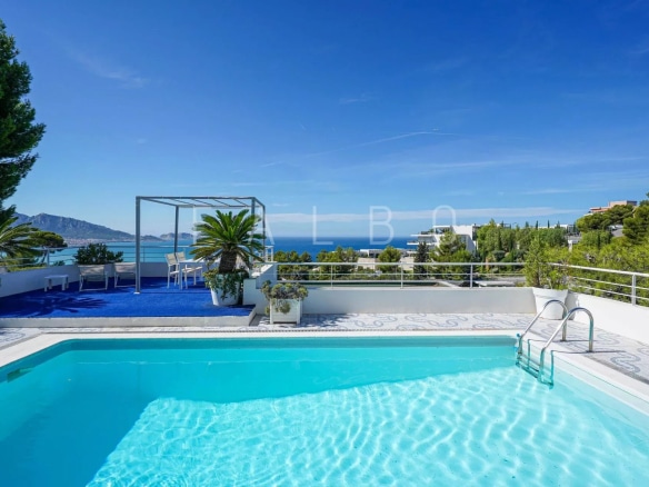 View from the swimming pool of a contemporary villa overlooking the sea in Marseille.