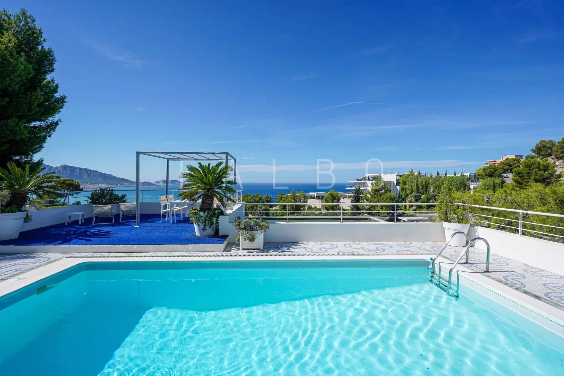 View from the swimming pool of a contemporary villa overlooking the sea in Marseille.