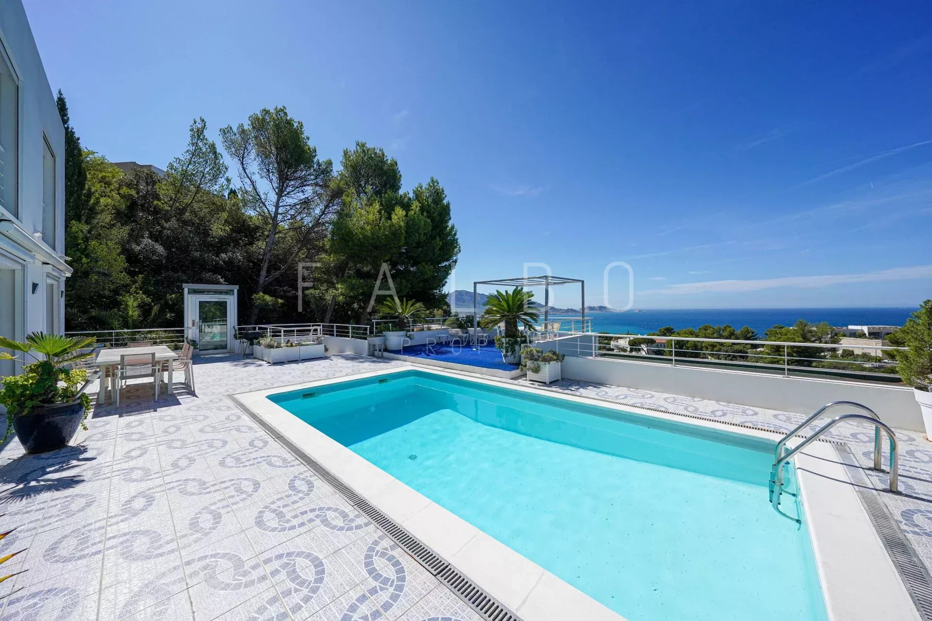 Contemporary villa with swimming pool and sea view in Marseille, sunny terrace.
