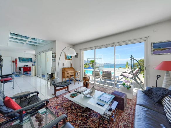 Interior of a contemporary villa with sea views, bright living room and open space.