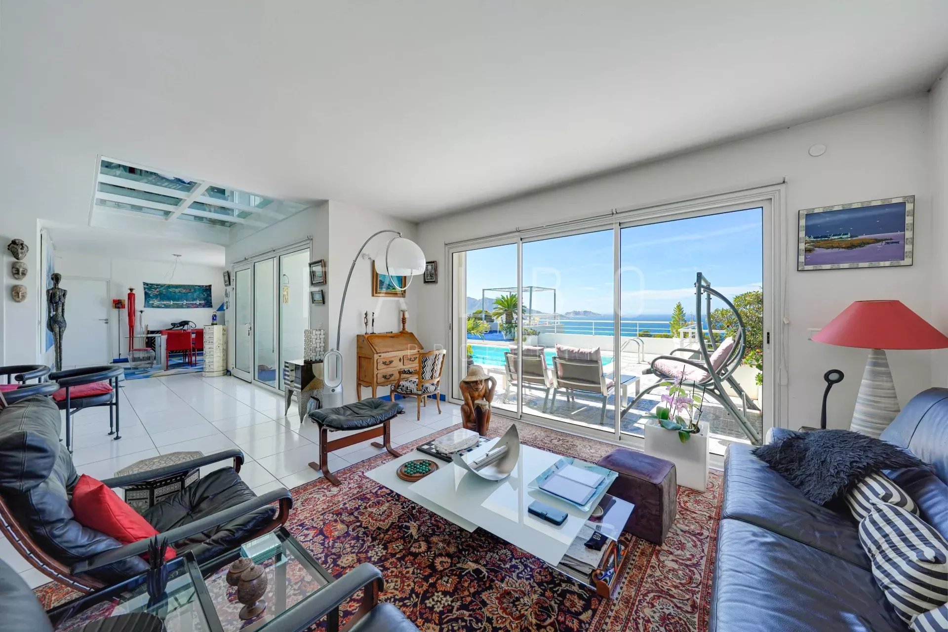 Interior of a contemporary villa with sea views, bright living room and open space.