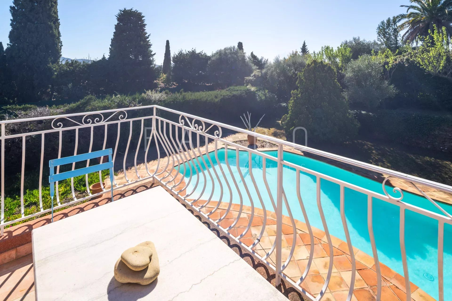 View from a terrace with swimming pool and garden in a villa in La Ciotat