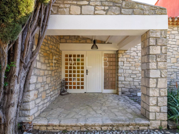 Entrance to a stone villa with a porch and stone floor, La Ciotat.