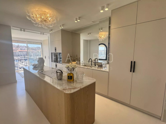Modern and bright kitchen in a renovated apartment overlooking the Old Port of Marseille.