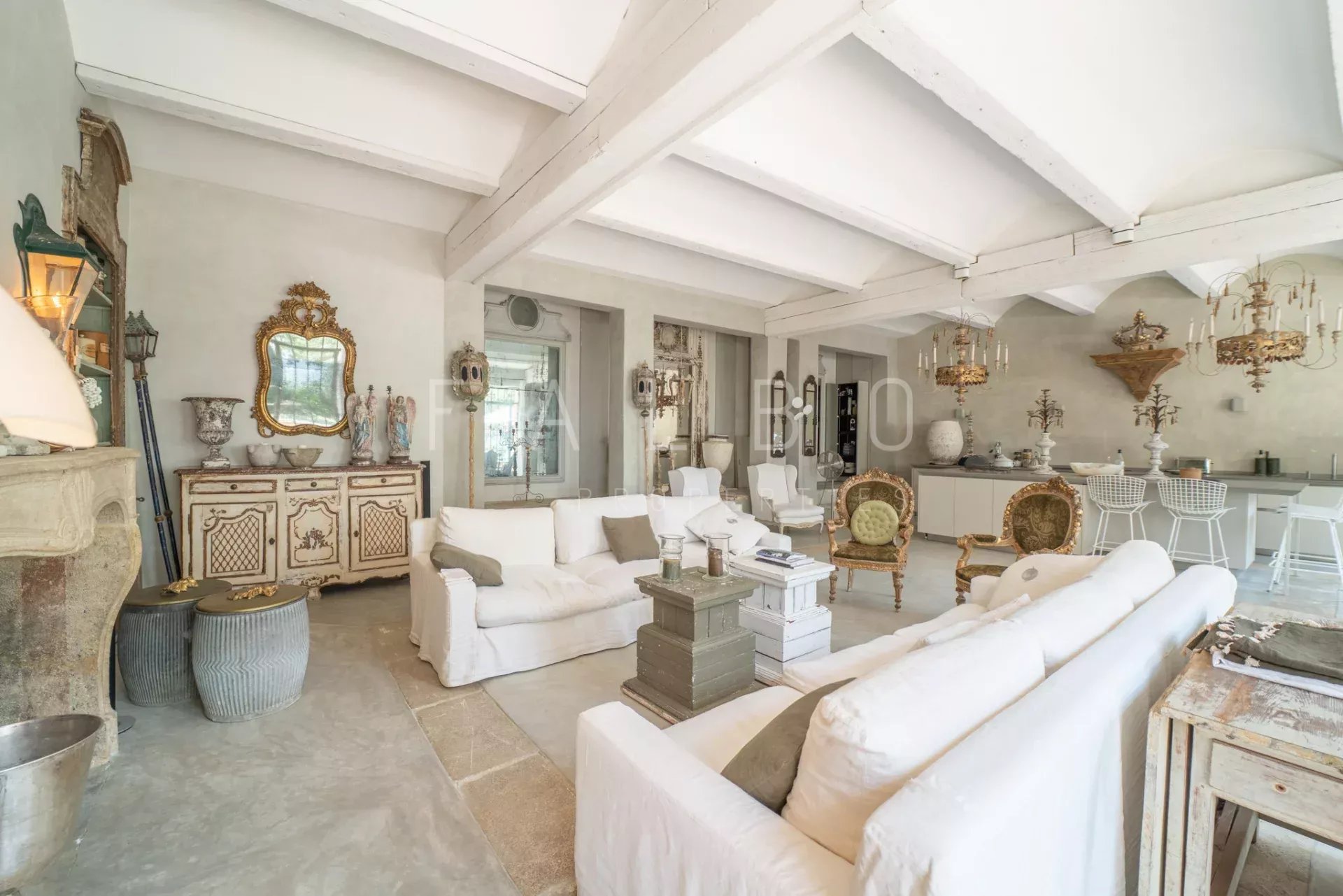 Interior of a Provençal farmhouse Interior of a renovated Provençal farmhouse with a large living room and elegant furniture.