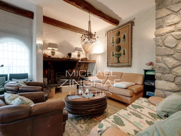 Interior of a house with fireplace and comfortable furniture, Provençal style.