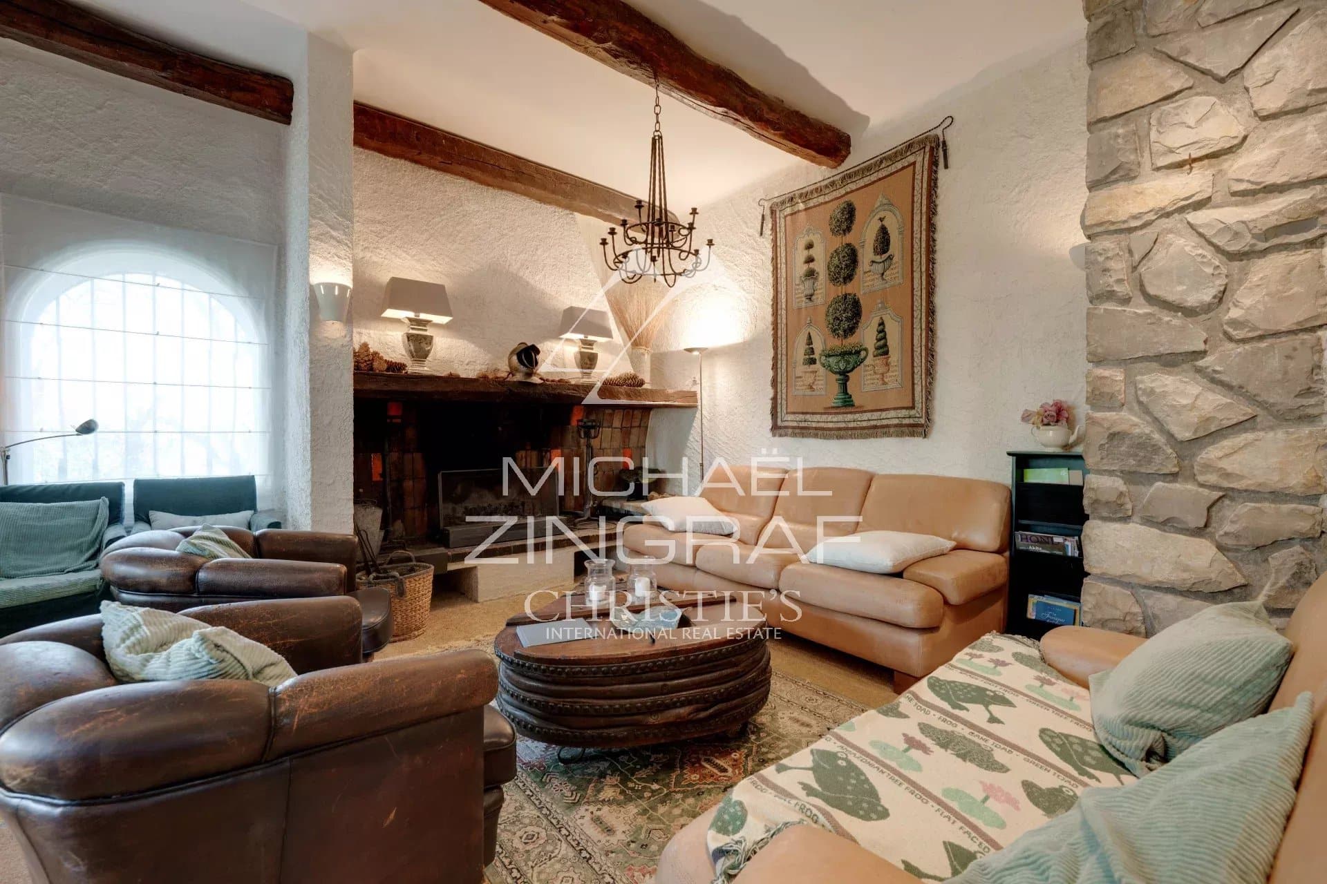 Interior of a house with fireplace and comfortable furniture, Provençal style.