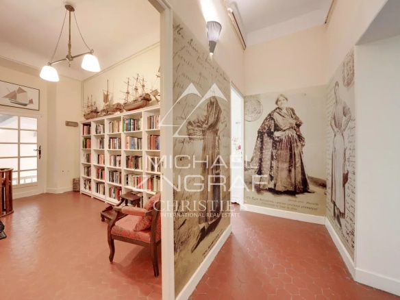 Interior of an estate with library and antique decorations.