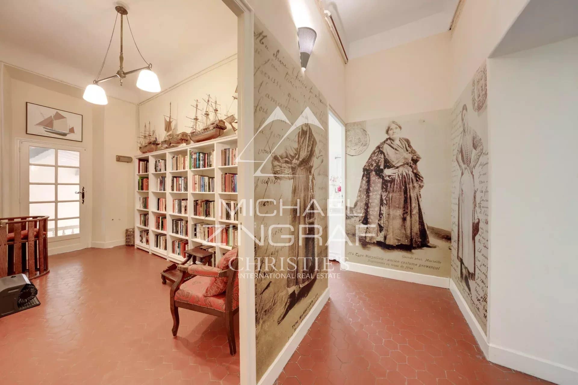 Interior of an estate with library and antique decorations.