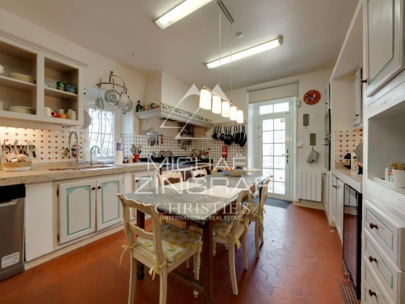 Kitchen in a Provençal estate with antique furniture and modern equipment.