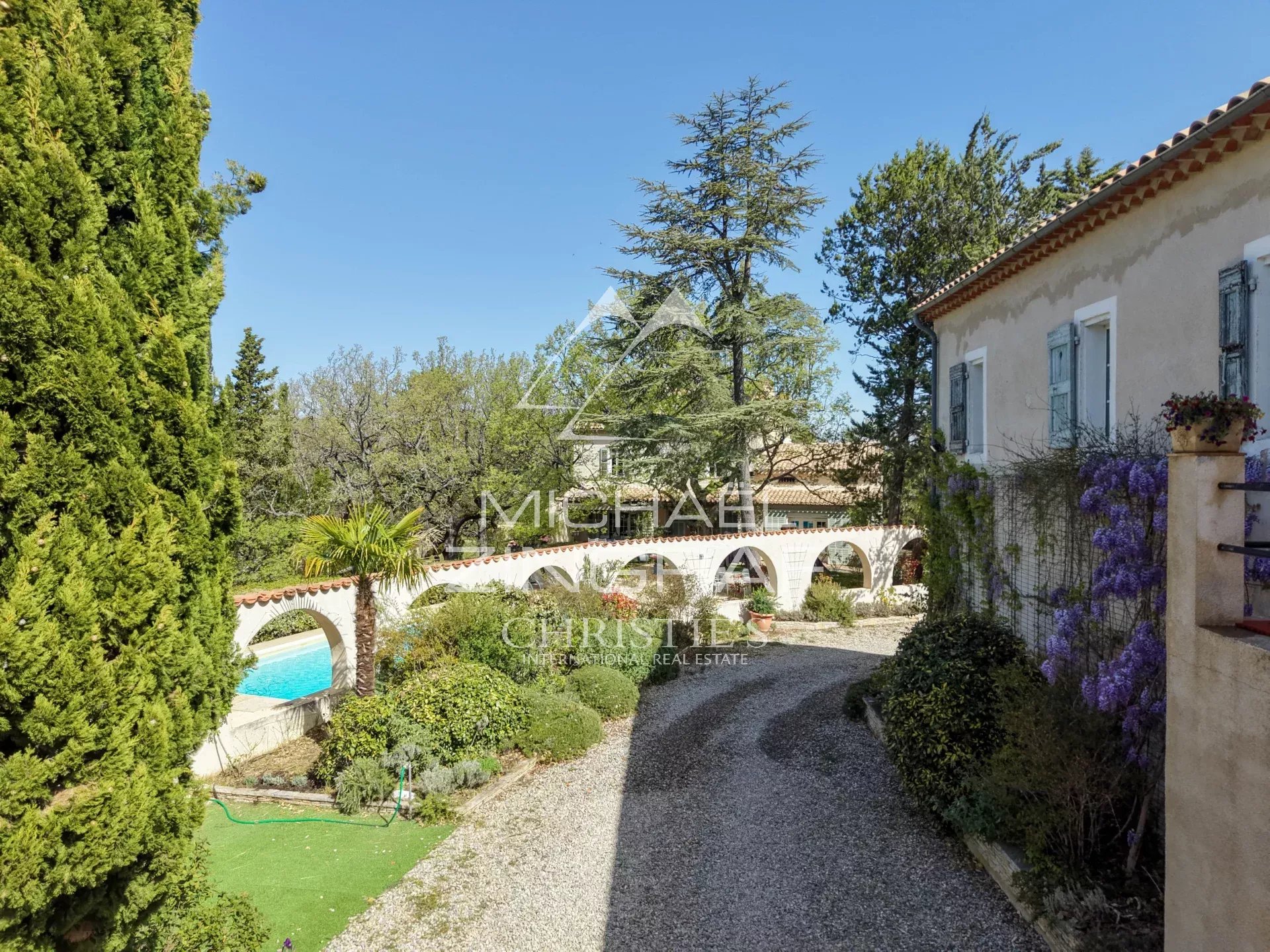 View of the Provençal estate with swimming pool and garden in Rians, France.