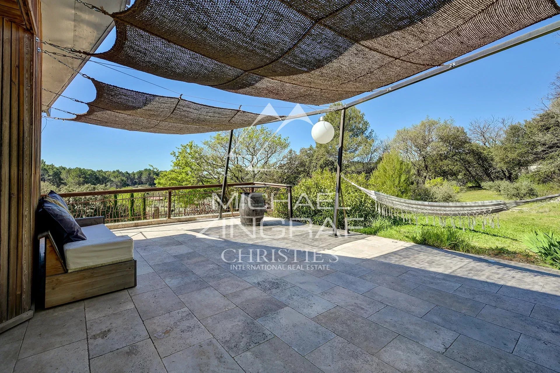 Terrace of a bright property with views of nature in Mérindol, France.