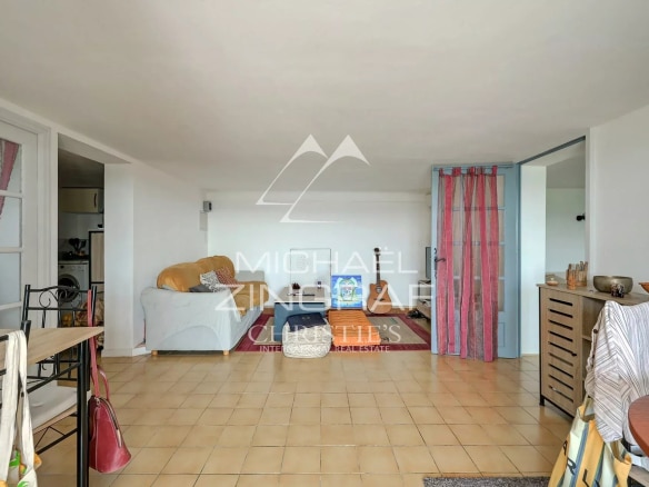 Interior of a property with a bright living space and simple decor.