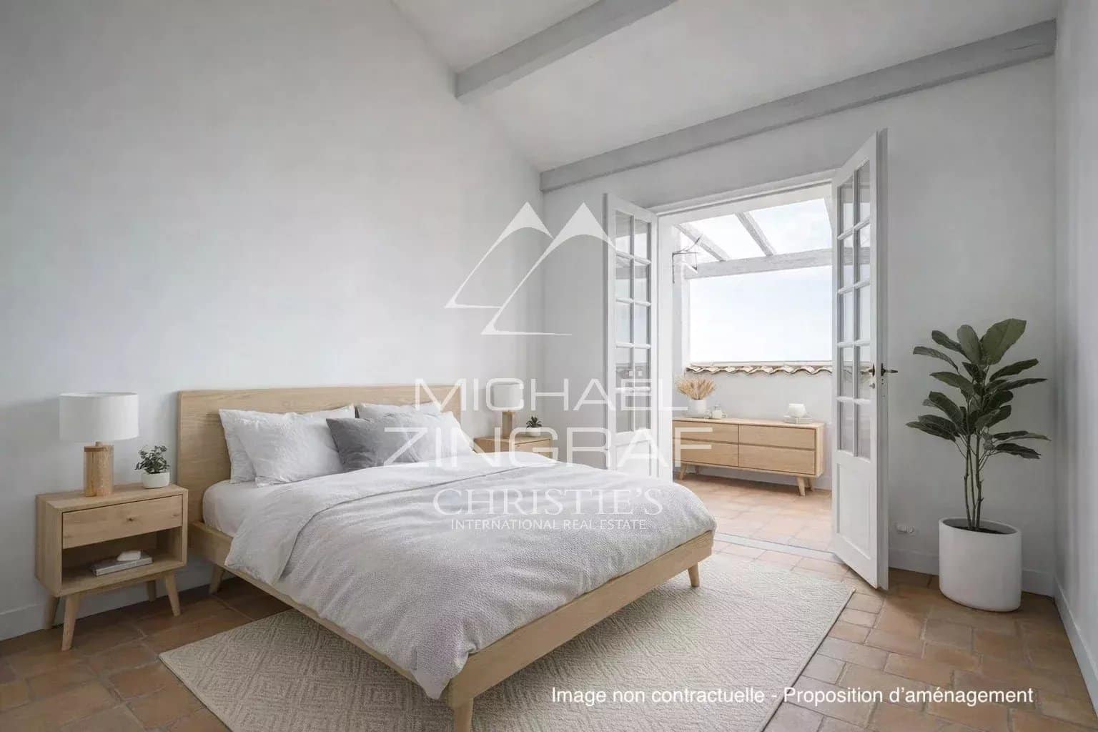 Bright room with double bed and light wood furniture, windows opening onto a balcony.