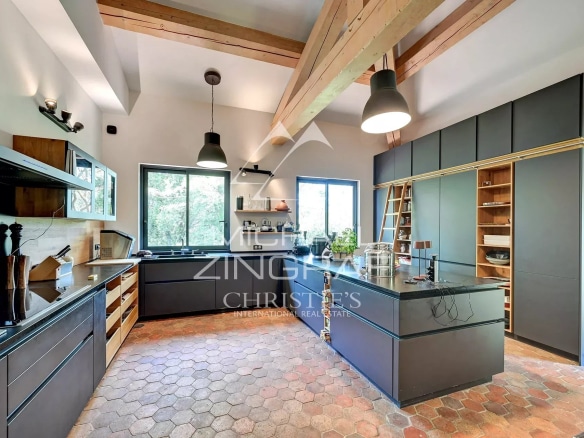 Modern and spacious kitchen with central island in a property in Aix-en-Provence.