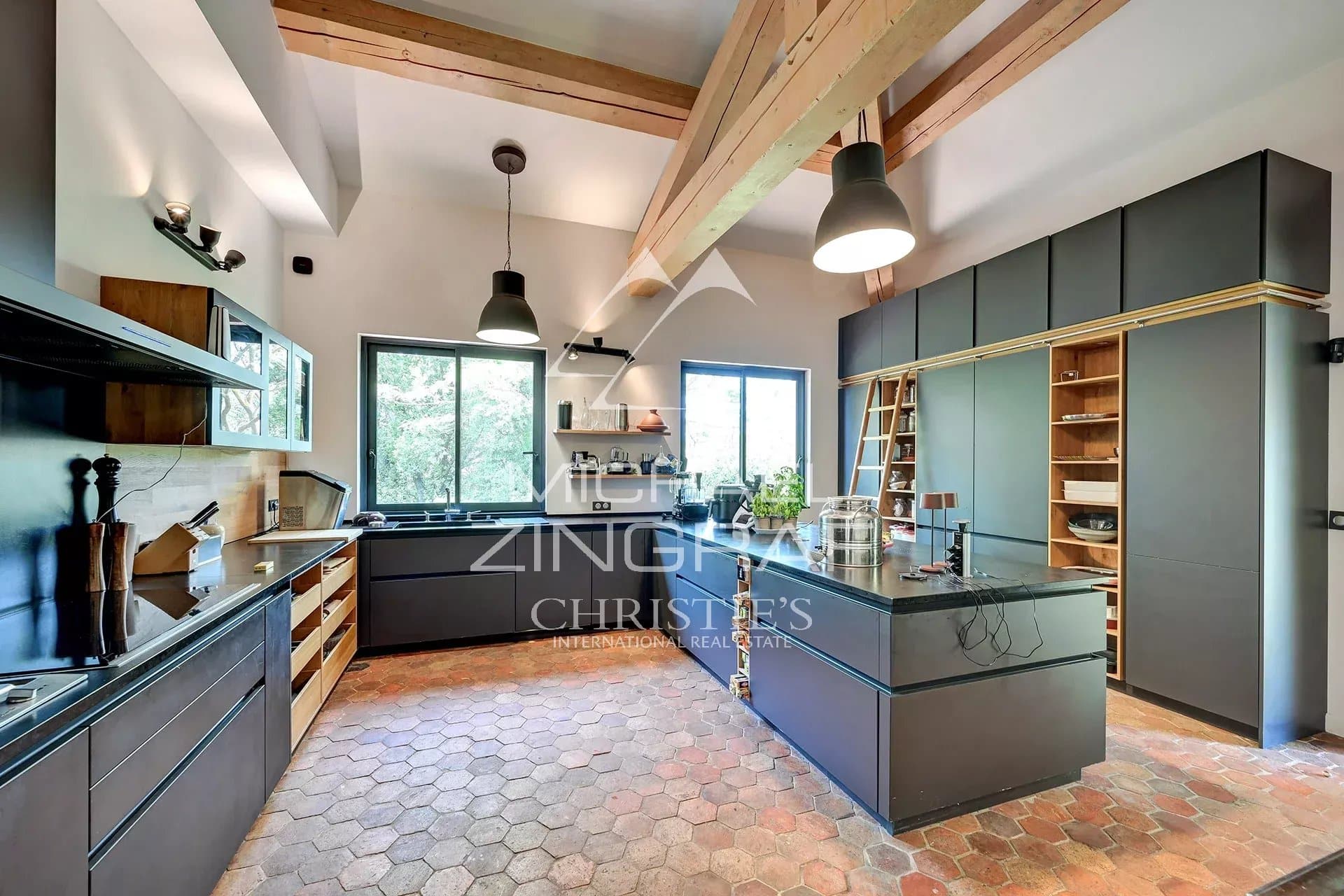 Modern and spacious kitchen with central island in a property in Aix-en-Provence.