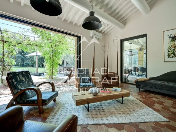 Interior of a spacious property with a bright living room and access to a garden.