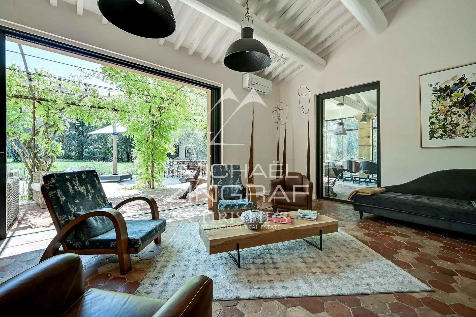Interior of a spacious property with a bright living room and access to a garden.