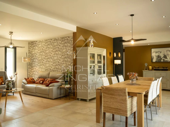 Interior of a contemporary property in Puget, modern living room and dining room.
