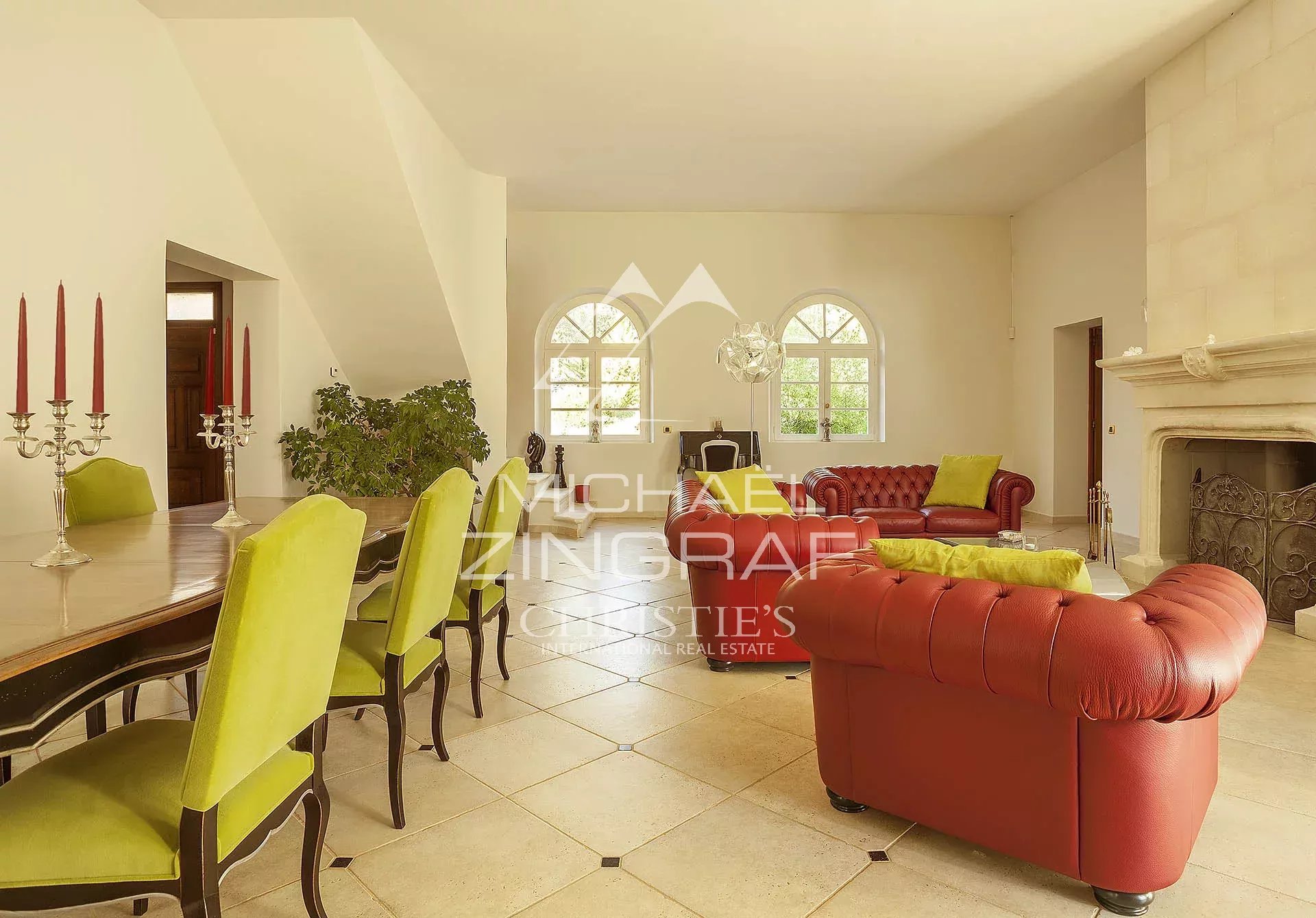 Interior of a bourgeois property Interior of a bourgeois house with a bright living room, modern furniture and a fireplace.