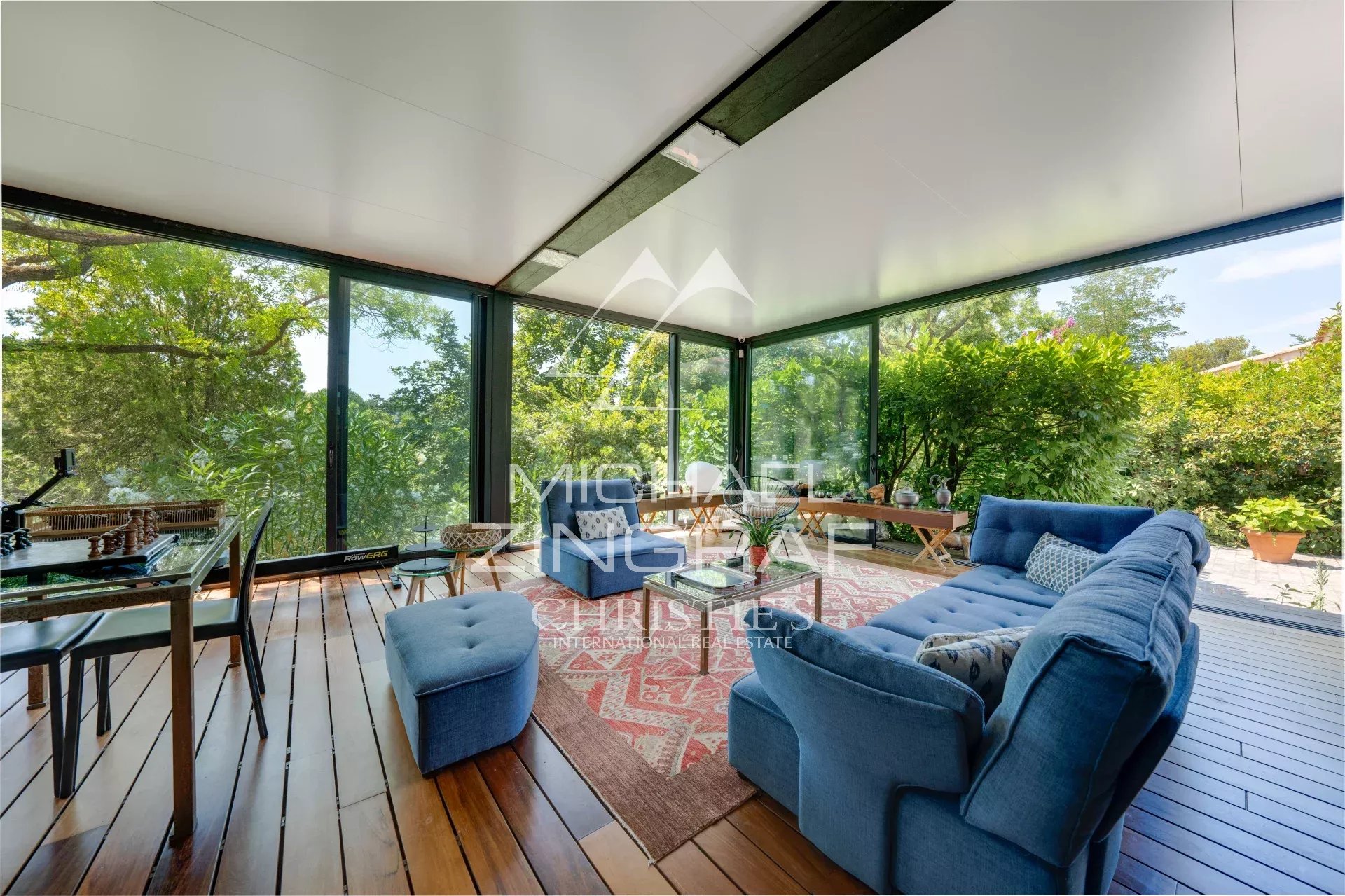 Interior of a property in Aix-en-Provence Interior of an elegant property with a bright living room and a view of a green park.