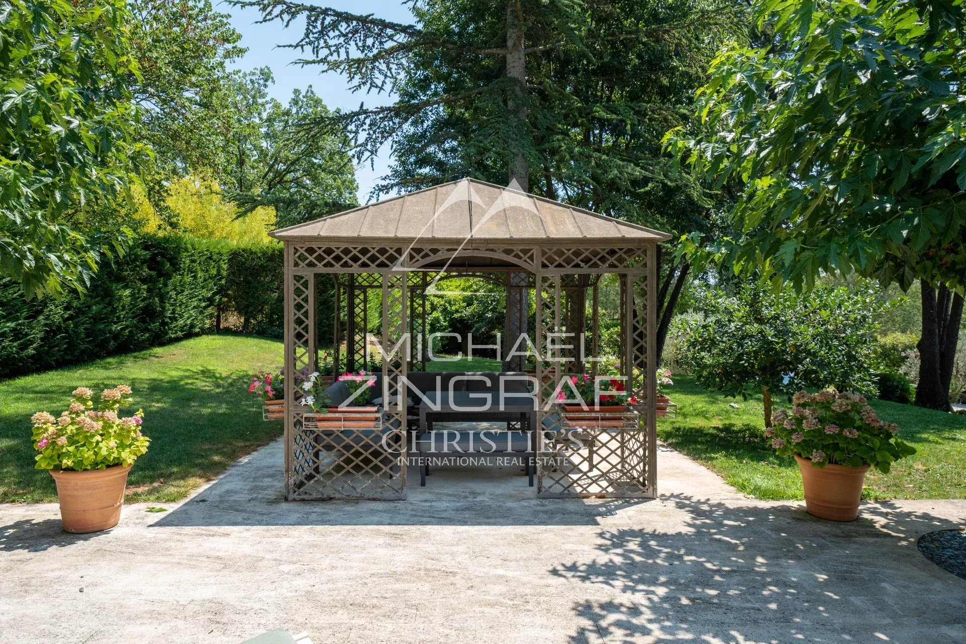 Garden shed in Aix-en-Provence Wooden garden shed in a landscaped park with flowers and trees in Aix-en-Provence.