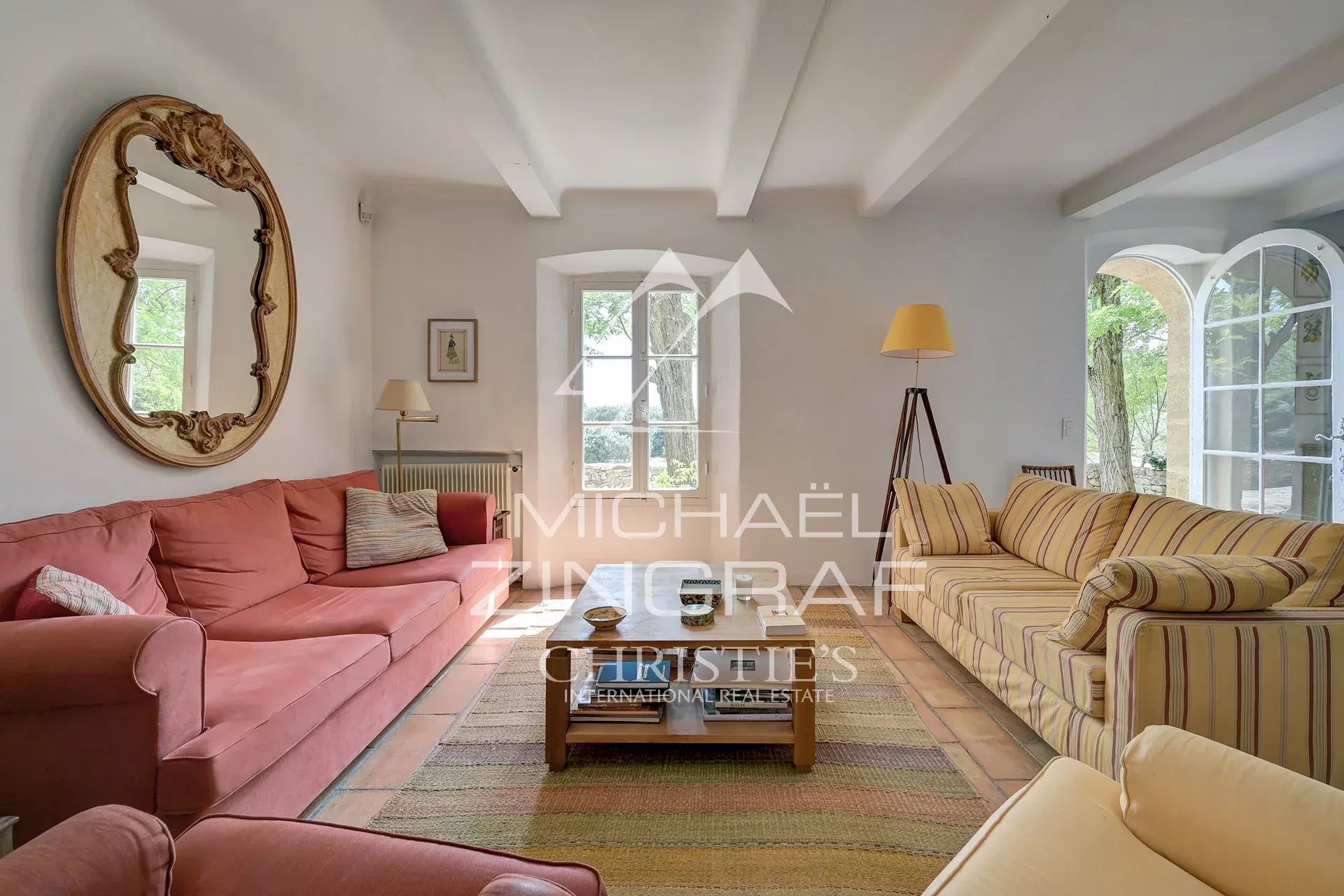 Living room of a Provençal country house Interior of a 19th century Provençal country house with a bright living room and comfortable furniture.